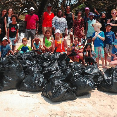 Children and staff keeping the beach clean